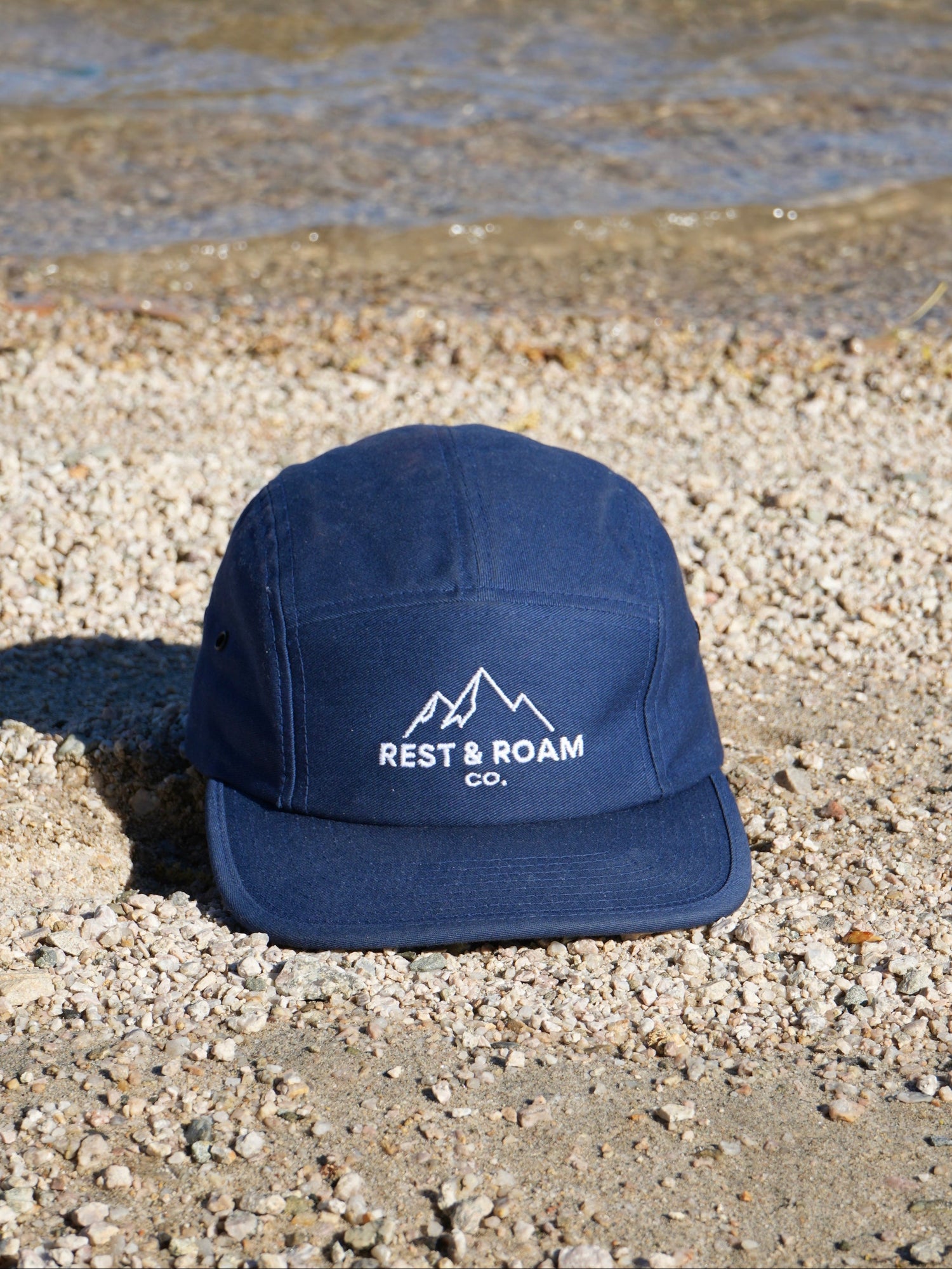 A five-panel hat with the Rest & Roam logo, styled for everyday wear and time spent outdoors.