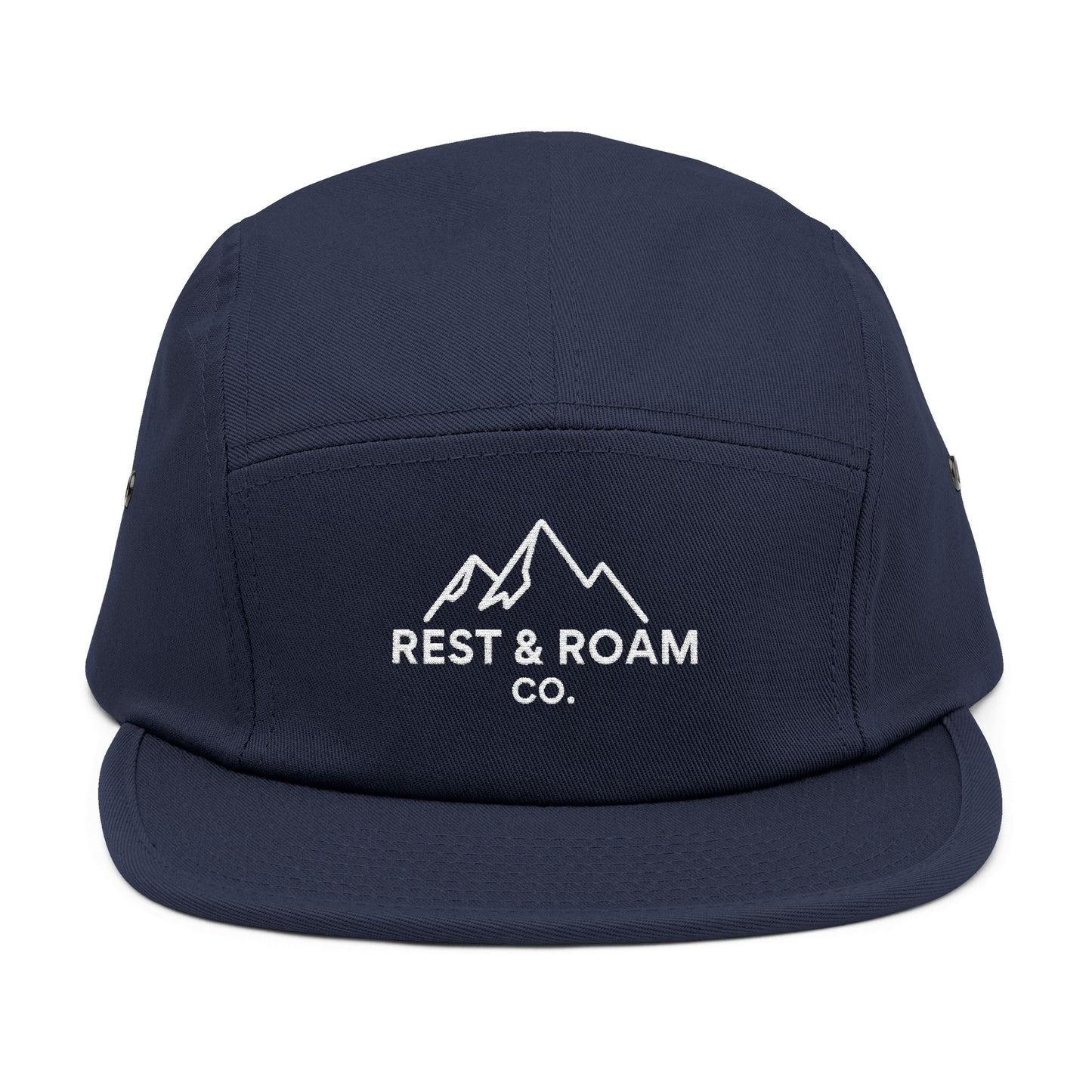 Close-up of a Navy embroidered 5-panel camp hat with Rest & Roam Co. mountain logo on front panel