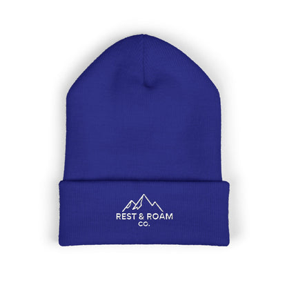 Blue beanie with 'Rest & Roam Co.' logo on a white background