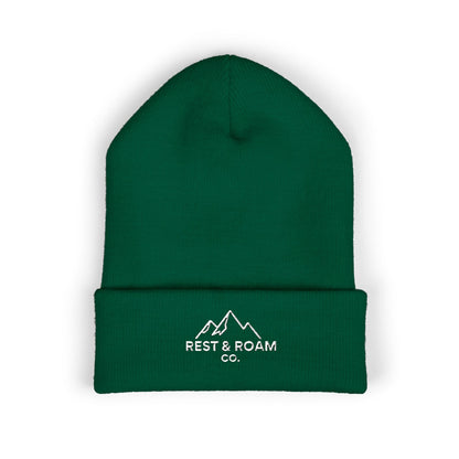 Green beanie with 'Rest & Roam Co.' logo on a white background