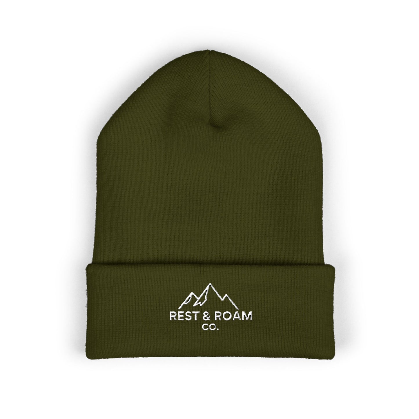Flat lay of a cuffed knit olive beanie with small embroidered Rest & Roam Co. mountain logo on cuff.