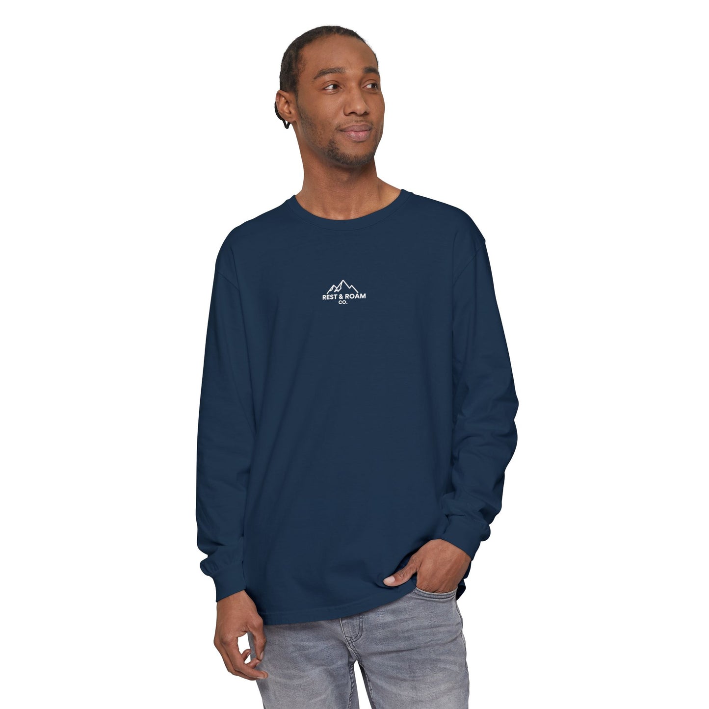 Man wearing a navy blue long-sleeve shirt with Rest & Roam Co. mountain logo on a white background