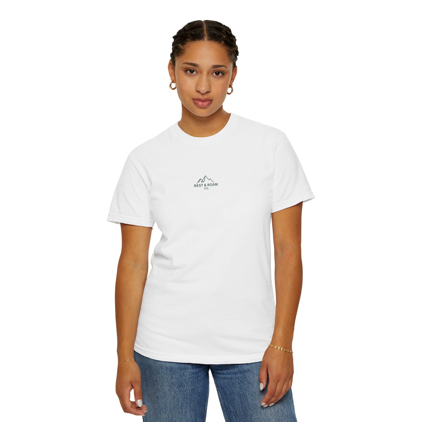Person wearing a plain white t-shirt and blue jeans on a white background